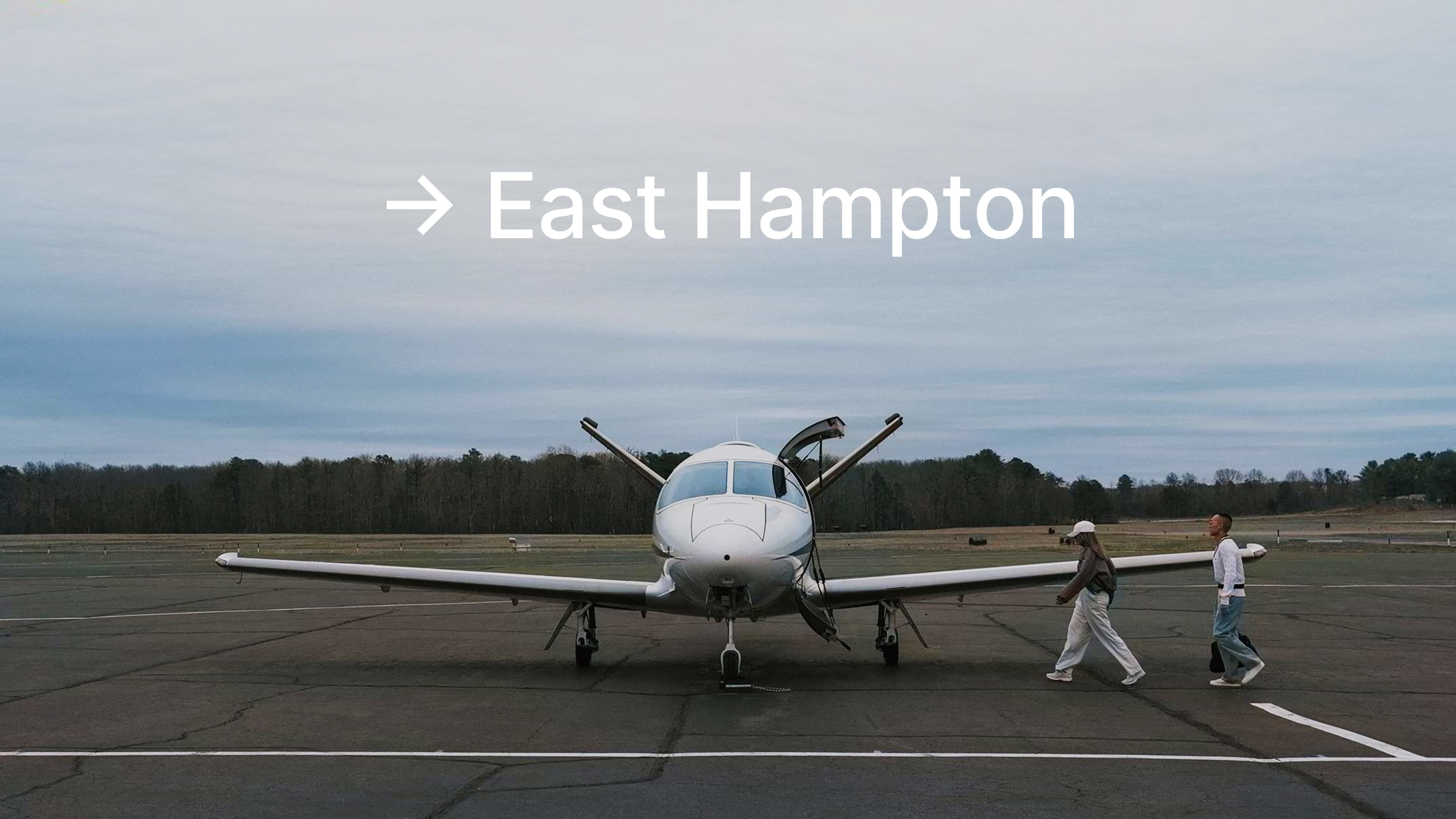 Couple boarding Cirrus Vision Jet in East Hampton Airport JPX